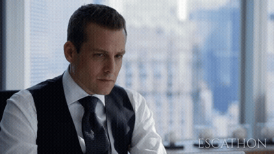 Man In Suit Sitting By Window Saying Escathon GIF