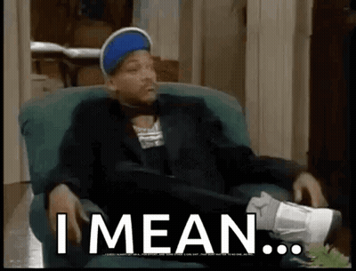 Man In Suit Sitting Cross-Legged Saying Yeh Well GIF