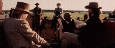 Man In Suit Sitting Eyes Closed Smiling GIF