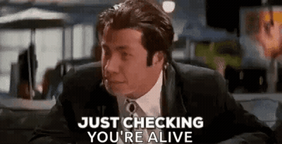 Man in Suit Sitting in Car Saying Just Checking You're Alive