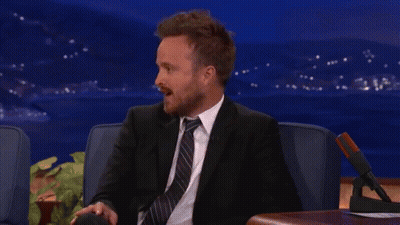 Man In Suit Sitting In Chair GIF
