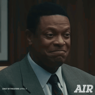 Man In Suit Sitting In Chair Saying Air GIF
