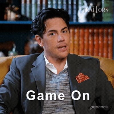 Man In Suit Sitting In Chair Saying Game On GIF