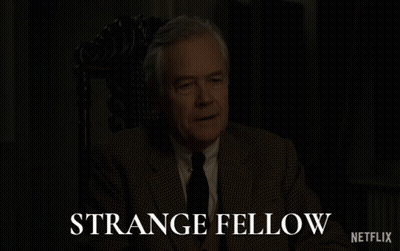 Man In Suit Sitting In Chair Strange Fellow Netflix GIF