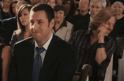 Man In Suit Sitting In Crowd GIF