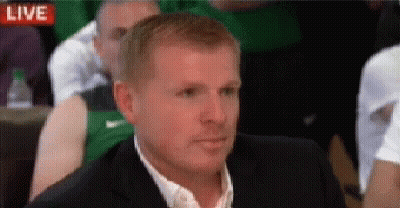 Man In Suit Sitting In Front Of Live Screen GIF