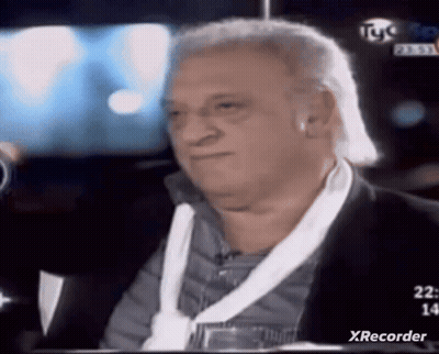 Man In Suit Sitting In Front Of TV Saying Xrecorder GIF
