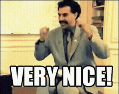 Man In Suit Sitting In Front Of Whiteboard Saying Very Nice GIF