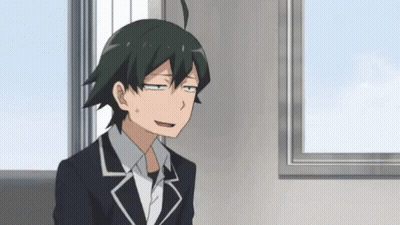 Man In Suit Sitting In Front Of Window Making Funny Face GIF