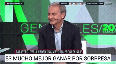 Man In Suit Sitting In Front Of Zapatero Green Screen GIF