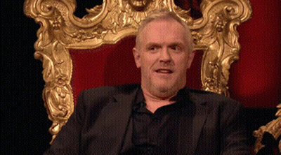 Man In Suit Sitting In Gold Frame Chair GIF