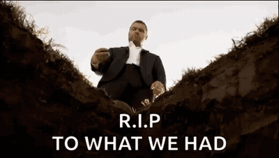 Man In Suit Sitting In Grave R.I.P GIF