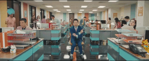 Man In Suit Sitting In Office Chair GIF