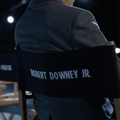 Man In Suit Sitting In Pedro Pascal Jr Chair GIF