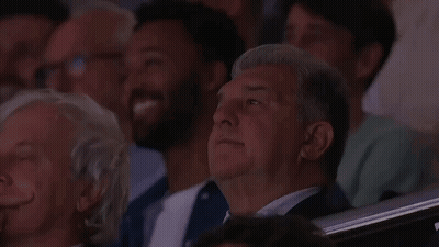 Man In Suit Sitting In Stadium GIF