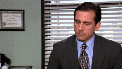 Man In Suit Sitting Near Window GIF