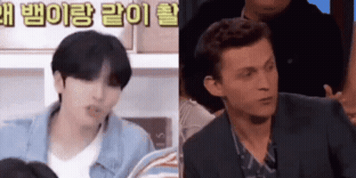 Man In Suit Sitting Next To Man In Blue Jacket GIF