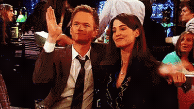Man In Suit Sitting Next To Woman In Bar GIF