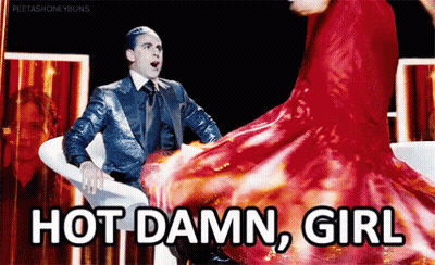 Man In Suit Sitting Next To Woman In Red Dress Dancing GIF