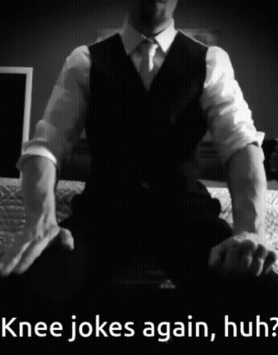 Man In Suit Sitting On Bed Knee Jokes Again Huh GIF