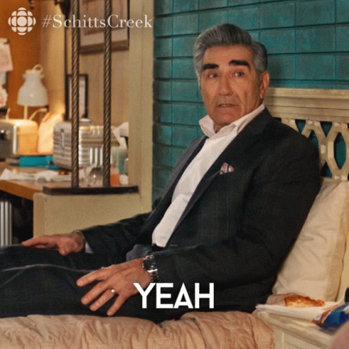 Man In Suit Sitting On Bed Yeah GIF
