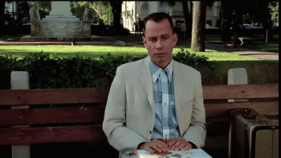 Man In Suit Sitting On Bench With Book GIF