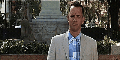 Man In Suit Sitting On Bench GIF