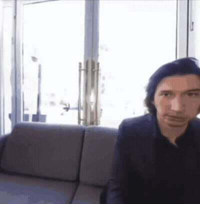 Man In Suit Sitting On Couch By Window GIF
