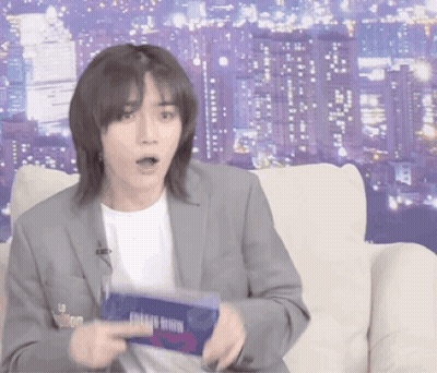 Man In Suit Sitting On Couch Holding Bingo Box GIF