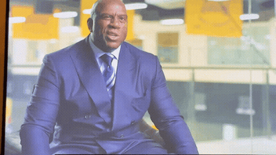 Man In Suit Sitting On Couch GIF