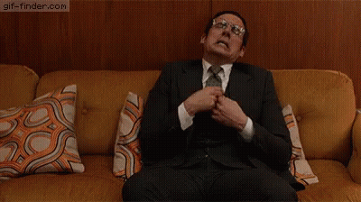 Man In Suit Sitting On Couch GIF