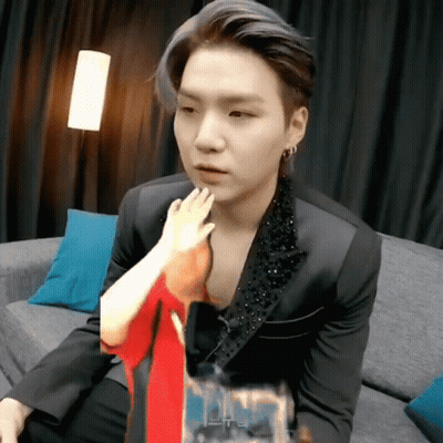 Man in Suit Sitting on Couch