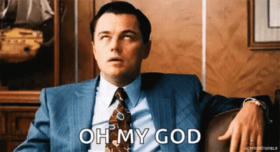 Man In Suit Sitting On Couch Says Oh My God GIF