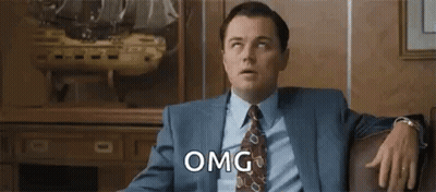 Man In Suit Sitting On Couch GIF