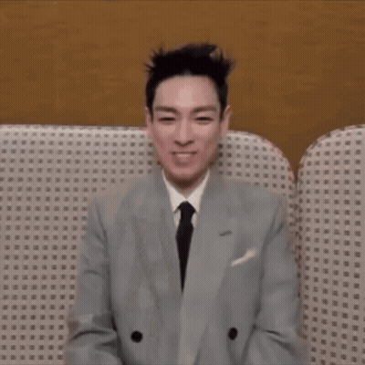 Man In Suit Sitting On Couch With Eyes Closed GIF