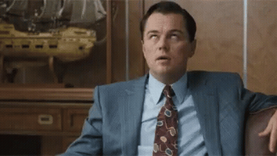 Man In Suit Sitting On Couch GIF