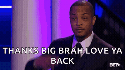 Man In Suit Sitting On Stage Saying Thanks Big Brah Love Ya Back GIF