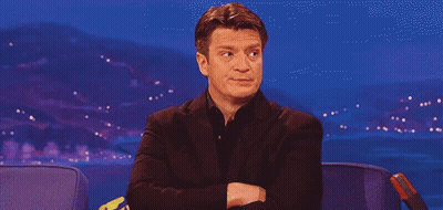 Man In Suit Sitting With Arms Crossed GIF