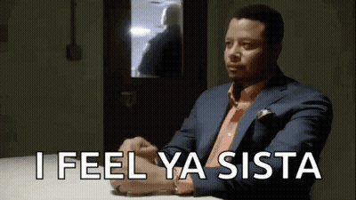 Man In Suit Sitting With Arms Crossed Saying I Feel Ya Sista GIF