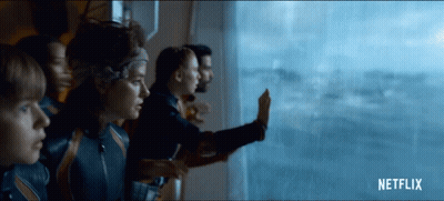 Man In Suit Sitting With Arms Outstretched And Smile GIF