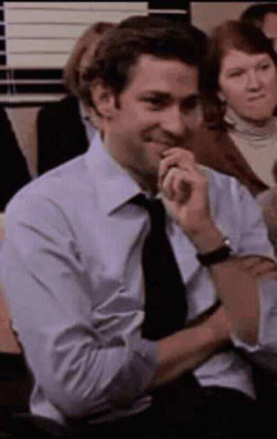 Man In Suit Sitting With Chin On Hand GIF