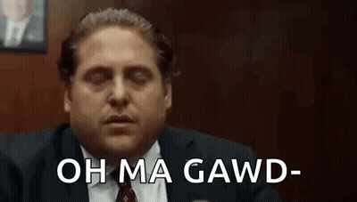 Man In Suit Sitting With Eyes Closed Saying Oh Ma Gawd GIF