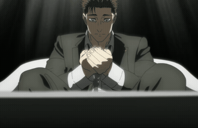 Man In Suit Sitting With Hands Folded GIF