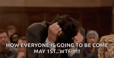 Man In Suit Sitting With Head In Hands GIF