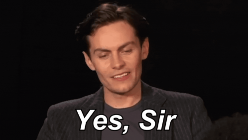 Man In Suit Smiling And Saying Yes Sir GIF