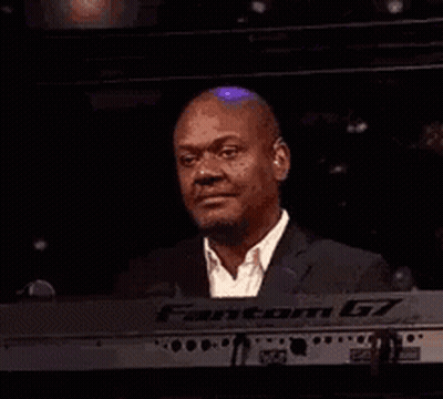Man In Suit Smiling At Keyboard GIF