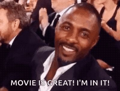 Man In Suit Smiling At Movie Premiere GIF