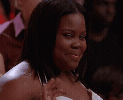 Man In Suit Smiling Before Crowd GIF