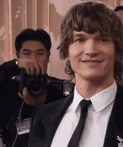 Man In Suit Smiling For Photo GIF