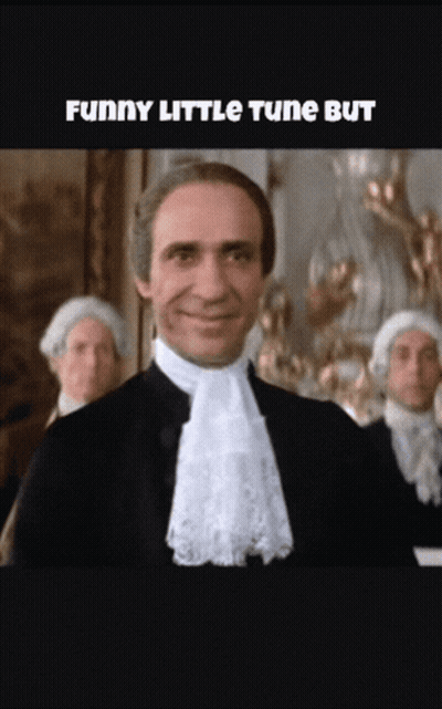 Man In Suit Smiling Funny Little Tune GIF